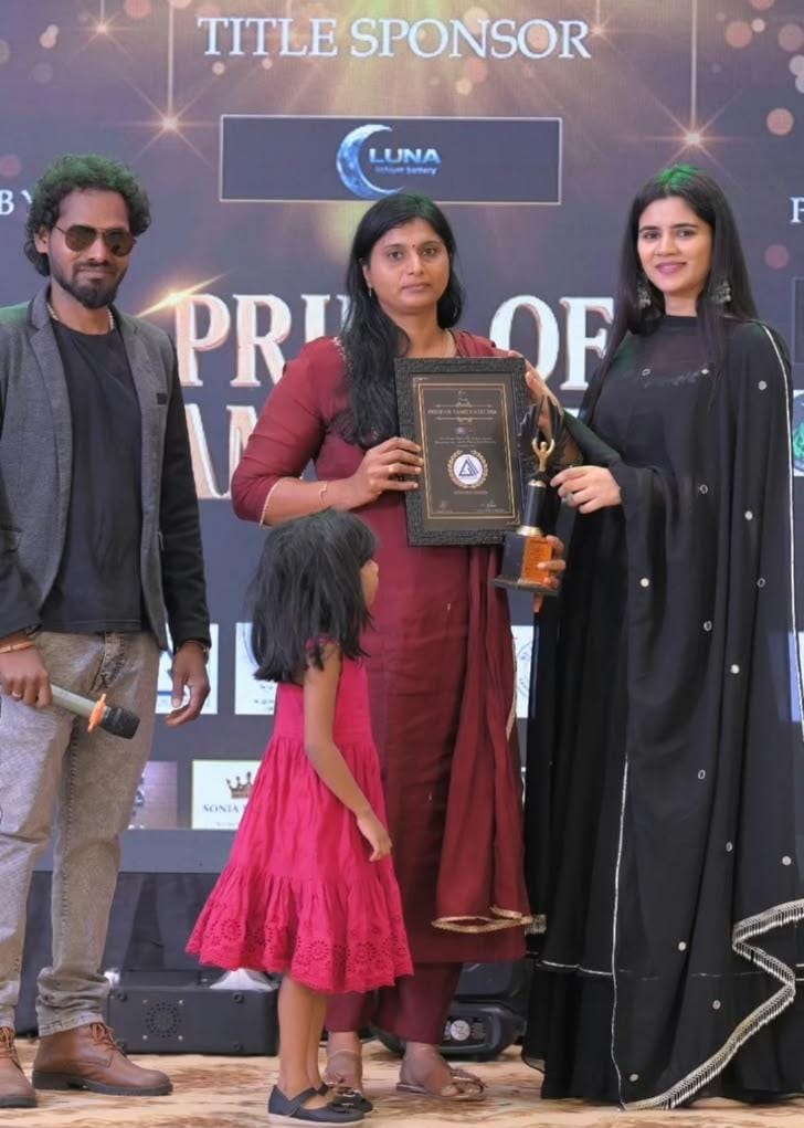 Mary Remya receiving the Pride of Tamil Nadu Award for traditional seafood pickle preservation